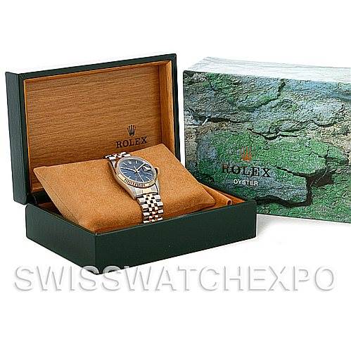 This image shows a Rolex Datejust 16233 Men's Steel and Gold (two tone) Blue Dial 16233 Men's Steel and Gold (two tone) Blue Dial watch, displayed in an open box with its packaging beside it.