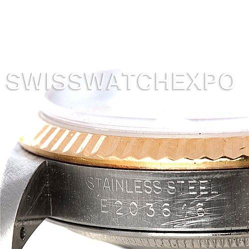 The image shows a close-up angle of the case of a Rolex Datejust 16233 Men's Steel and Gold (two tone) Blue Dial 16233 Men's Steel and Gold (two tone) Blue Dial watch, highlighting the bezel and stainless steel casing.