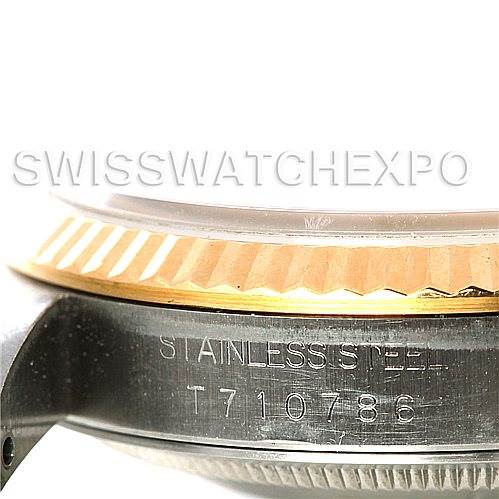 The image shows a close-up of the side of a Rolex Datejust 16233 Men's Steel and Gold (two tone) White Dial 16233 Men's Steel and Gold (two tone) White Dial watch, focusing on the stainless steel case and the fluted bezel.