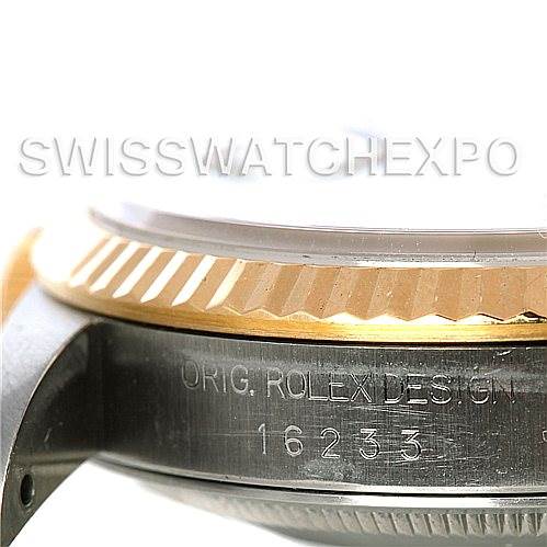 This image showcases a close-up side view of a Rolex Datejust 16233 Men's Steel and Gold (two tone) White Dial 16233 Men's Steel and Gold (two tone) White Dial watch, highlighting the bezel and case with engraved design number 16233.