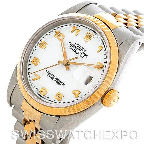 This image shows a close-up of a Rolex Datejust 16233 Men's Steel and Gold (two tone) White Dial 16233 Men's Steel and Gold (two tone) White Dial watch, highlighting the crown, bezel, dial, and part of the bracelet.