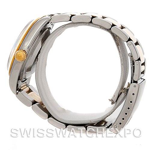 The Rolex Datejust 16203 Men
s Steel and Gold (two tone) White Dial 16203 Men
s Steel and Gold (two tone) White Dial watch is shown from a side angle, displaying the crown, case, and partially open metal bracelet.