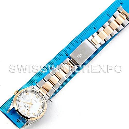 The image shows an overhead view of a Rolex Datejust 16203 Men
s Steel and Gold (two tone) White Dial 16203 Men
s Steel and Gold (two tone) White Dial watch, with the dial, bezel, and bracelet clearly visible against a ruler.