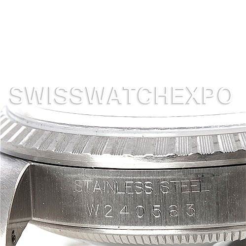 This image shows a close-up of the side of a Rolex Datejust 16220 Men's Stainless Steel Black Dial 16220 Men's Stainless Steel Black Dial watch, highlighting the stainless steel case with engraving.