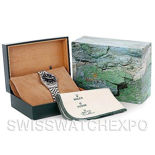 The image shows a Rolex Datejust 16220 Men's Stainless Steel Black Dial 16220 Men's Stainless Steel Black Dial watch displayed in its open box with accompanying cloth and outer packaging.