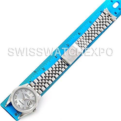 This image shows a top-down view of a Rolex Datejust 16234 Men's Stainless Steel Silver Dial 16234 Men's Stainless Steel Silver Dial watch, including the dial, bezel, and full bracelet, with a ruler for scale.