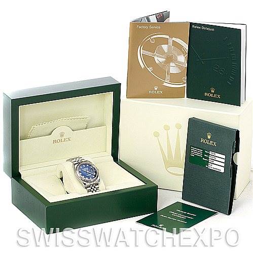 The image shows a Rolex Datejust 116234 Men's Stainless Steel Blue Dial 116234 Men's Stainless Steel Blue Dial watch in a green box with booklets and a warranty card arranged around it.