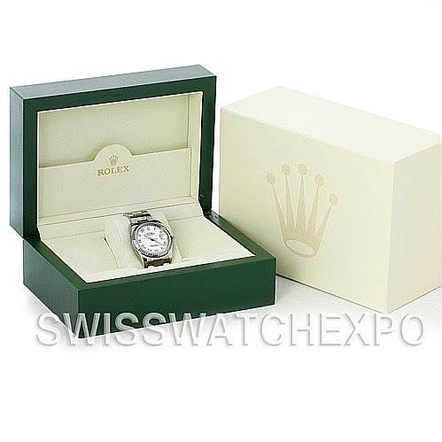 The image shows a Rolex Datejust 116234 Men's Stainless Steel White Dial 116234 Men's Stainless Steel White Dial watch in its green box next to its outer cream-colored case, photographed from the front.
