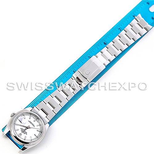 The image shows a Rolex Datejust 116200 Men's Stainless Steel White Dial 116200 Men's Stainless Steel White Dial watch, laid flat, displaying its face, bracelet, and clasp next to a blue ruler.
