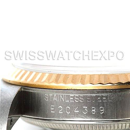 The image shows a close-up angle of the side of the Rolex Datejust 16233 Men's Steel and Gold (two tone) Mother of Pearl Dial 16233 Men's Steel and Gold (two tone) Mother of Pearl Dial watch, highlighting the stainless steel case with its serial number.