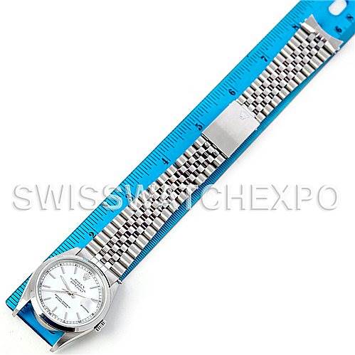 The image shows a top view of a Rolex Datejust 16200 Men's Stainless Steel White Dial 16200 Men's Stainless Steel White Dial watch laid next to a blue ruler for scale.