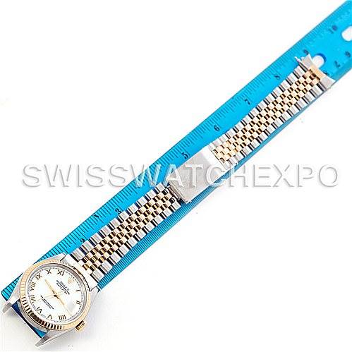 The image shows a Rolex Datejust 16233 Men's Steel and Gold (two tone) White Dial 16233 Men's Steel and Gold (two tone) White Dial watch laid flat with its bracelet next to a blue ruler for scale.