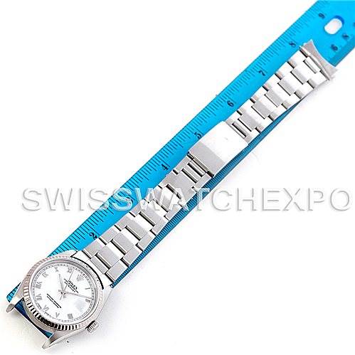 The image shows the front view of a Rolex Datejust 16234 Men's Stainless Steel White Dial 16234 Men's Stainless Steel White Dial model watch placed next to a blue measuring ruler.