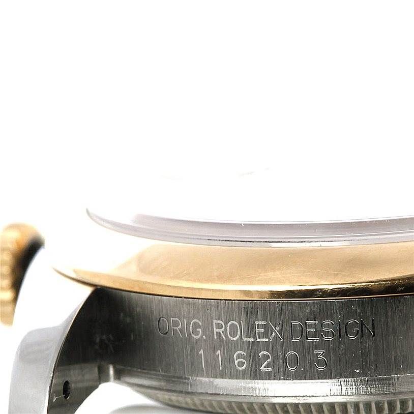 This image shows a close-up angle of the casing side of a Rolex Datejust 116203 Men's Stainless Steel Grey Dial 116203 Men's Stainless Steel Grey Dial watch, displaying the engraved original design and reference number.