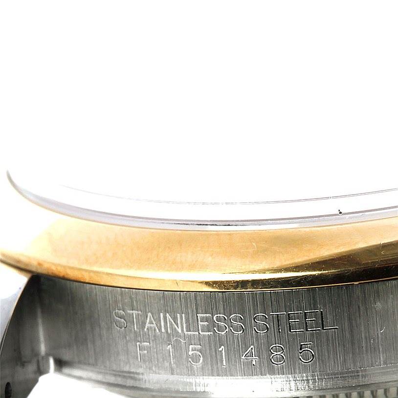 The image shows a close-up of the side engraving on a stainless steel Rolex Datejust 116203 Men's Stainless Steel Grey Dial 116203 Men's Stainless Steel Grey Dial watch, highlighting the serial number.