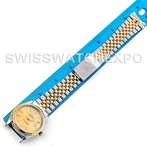 The image shows the Rolex Datejust 16233 Men's Steel and Gold (two tone) Champagne Dial 16233 Men's Steel and Gold (two tone) Champagne Dial watch laid flat with a blue ruler next to it, displaying the face and full bracelet.