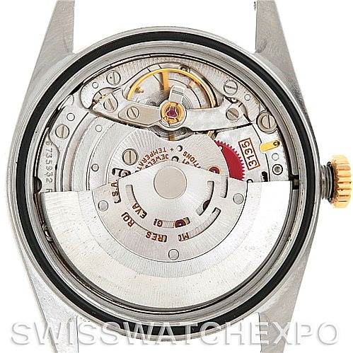 This is an image of the back view of a Rolex Datejust 16233 Men's Steel and Gold (two tone) Champagne Dial 16233 Men's Steel and Gold (two tone) Champagne Dial watch, showing its internal mechanical movement and parts.