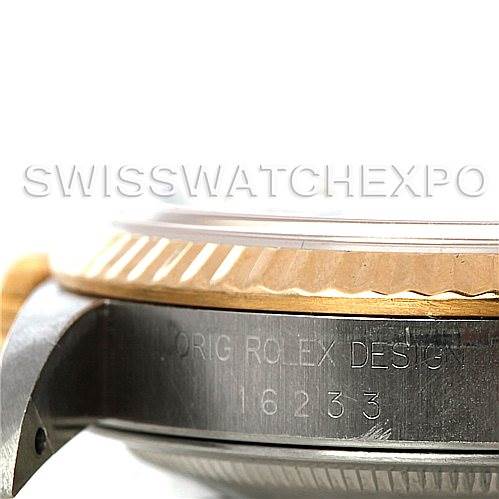 The image shows a side view of the Rolex Datejust 16233 Men's Steel and Gold (two tone) Champagne Dial 16233 Men's Steel and Gold (two tone) Champagne Dial model, focusing on its case, bezel, and engraved serial number.