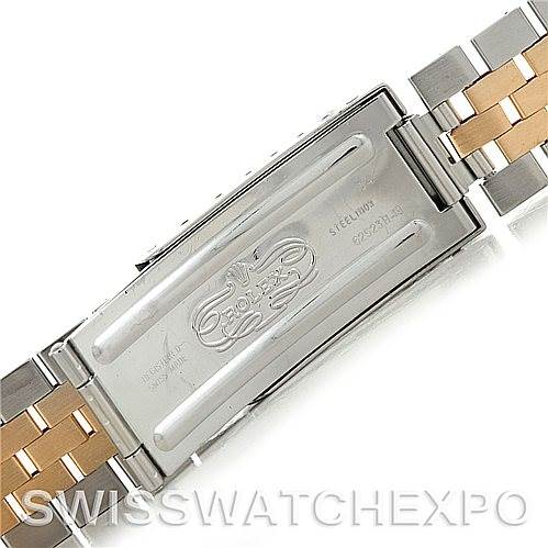 This image shows the clasp of a Rolex Datejust 16233 Men's Steel and Gold (two tone) Champagne Dial 16233 Men's Steel and Gold (two tone) Champagne Dial model, highlighting its oyster bracelet with steel and gold links.