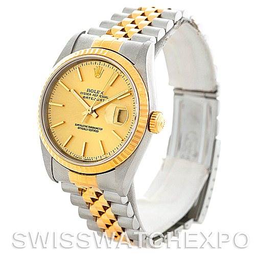 This image shows a Rolex Datejust 16233 Men's Steel and Gold (two tone) Champagne Dial 16233 Men's Steel and Gold (two tone) Champagne Dial watch at a slight angle, highlighting its two-tone bracelet, gold bezel, and champagne dial.