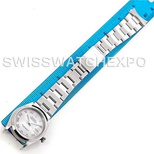 The image shows a top-down view of a Rolex Datejust Men's Stainless Steel Silver Dial Men's Stainless Steel Silver Dial watch with its full bracelet and a measuring ruler.