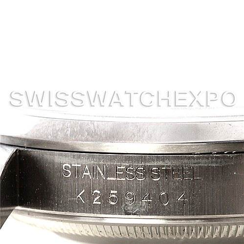 This close-up image shows the side engraving and part of the casing of the Rolex Datejust Men's Stainless Steel Silver Dial Men's Stainless Steel Silver Dial model, highlighting its serial number and "Stainless Steel" inscription.