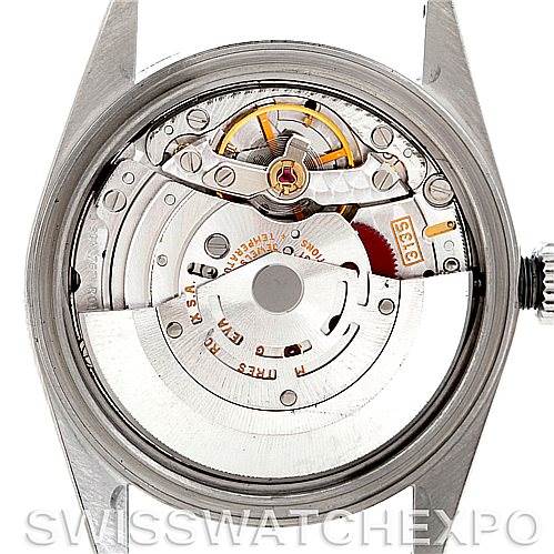 This image shows the back view of a Rolex Datejust Men's Stainless Steel Silver Dial Men's Stainless Steel Silver Dial watch, displaying its mechanical movement and internal components.
