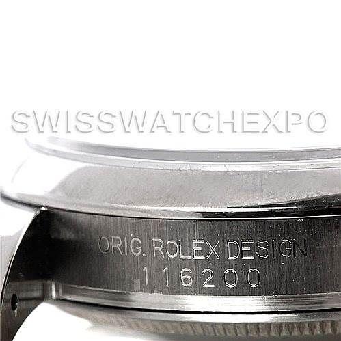 This image shows a close-up of the side of a Rolex Datejust 116200 Men's Stainless Steel Silver Dial 116200 Men's Stainless Steel Silver Dial watch case, featuring the engraving "ORIG. ROLEX DESIGN" and the model number.