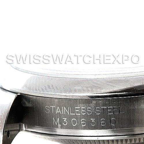 The image shows a close-up of the stainless steel casing and serial number of a Rolex Datejust 116200 Men's Stainless Steel Silver Dial 116200 Men's Stainless Steel Silver Dial watch.
