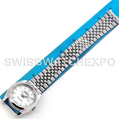 This image shows a Rolex Datejust 116200 Men's Stainless Steel Silver Dial 116200 Men's Stainless Steel Silver Dial watch laid flat next to a blue ruler, displaying the face and full band.