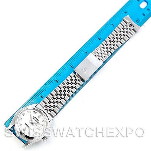 The image shows a Rolex Datejust 16200 Men's Stainless Steel Beige Dial 16200 Men's Stainless Steel Beige Dial watch laid flat next to a blue ruler, displaying both the watch face and the bracelet.