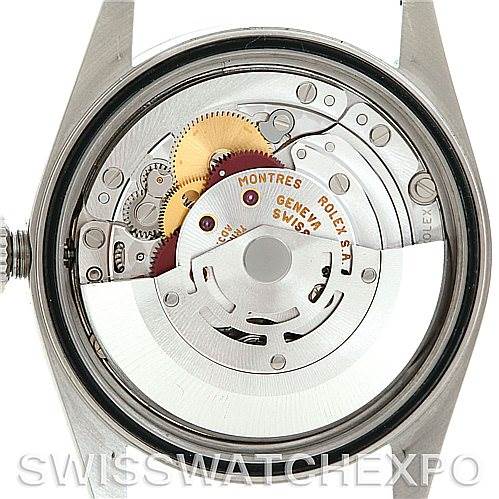 This image shows the internal movement of a Rolex Datejust 16200 Men's Stainless Steel Beige Dial 16200 Men's Stainless Steel Beige Dial watch from the back, featuring gears and rotating components.