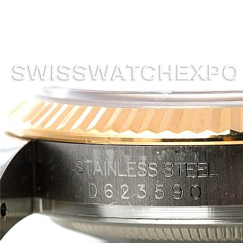 This image shows a close-up side angle of the Rolex Datejust 116233 Men
s Stainless Steel Black Dial 116233 Men
s Stainless Steel Black Dial watch
s casing, highlighting its stainless steel material and fluted bezel.