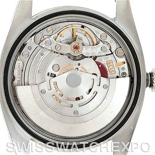 This image shows the exposed movement and inner workings of a Rolex Datejust 116234 Men's Stainless Steel Silver Dial 116234 Men's Stainless Steel Silver Dial watch from a top-down angle.