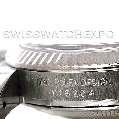 This image shows a close-up side view of the case of a Rolex Datejust 116234 Men's Stainless Steel Silver Dial 116234 Men's Stainless Steel Silver Dial watch, highlighting the engraved model number and the fluted bezel.