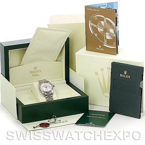 The image shows a Rolex Datejust 116234 Men's Stainless Steel Silver Dial 116234 Men's Stainless Steel Silver Dial watch at an angle in its open box, with warranty cards, booklets, and a cleaning cloth nearby.