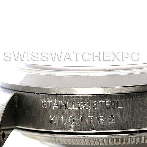 The image shows the side view of a Rolex Datejust 16200 Men's Stainless Steel Silver Dial 16200 Men's Stainless Steel Silver Dial watch, focusing on the stainless steel casing with an engraved serial number.