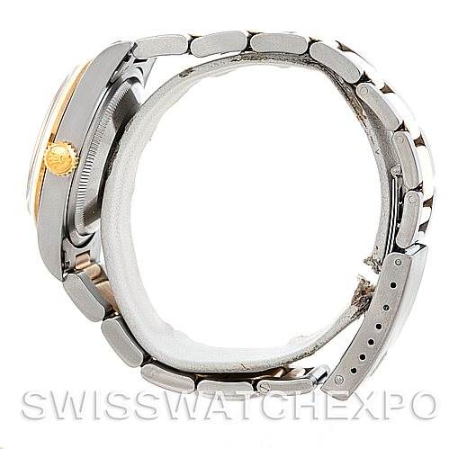 This is a side view of a Rolex Datejust 16203 Men
s Steel and Gold (two tone) Champagne Dial 16203 Men
s Steel and Gold (two tone) Champagne Dial watch displaying its bracelet, clasp, and crown.