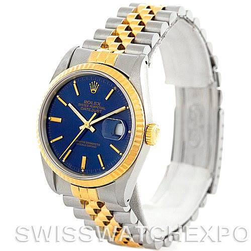 The Rolex Datejust 16233 Men
s Steel and Gold (two tone) Blue Dial 16233 Men
s Steel and Gold (two tone) Blue Dial watch is shown from a front angle, displaying the blue dial, two-tone bracelet, and cyclops lens over the date.