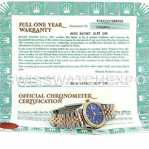 The image features a Rolex Datejust 16233 Men
s Steel and Gold (two tone) Blue Dial 16233 Men
s Steel and Gold (two tone) Blue Dial watch with a two-tone bracelet and blue dial, placed on top of its warranty and certification papers.