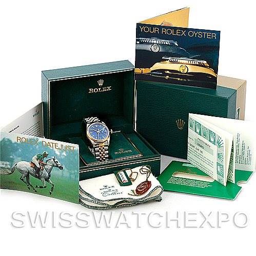 The image shows a Rolex Datejust 16233 Men
s Steel and Gold (two tone) Blue Dial 16233 Men
s Steel and Gold (two tone) Blue Dial watch in its box with various accessories including manuals, tags, and certification papers.