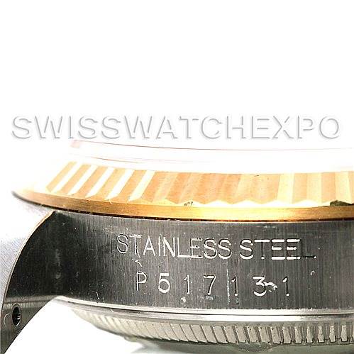 This image shows a side view of a Rolex Datejust 16233 Men's Steel and Gold (two tone) Champagne Dial 16233 Men's Steel and Gold (two tone) Champagne Dial watch case, highlighting the stainless steel engraving and part of the fluted bezel.