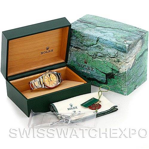 The image shows a Rolex Datejust 16233 Men's Steel and Gold (two tone) Champagne Dial 16233 Men's Steel and Gold (two tone) Champagne Dial watch, its open case, outer box, tags, and cleaning cloth from a side-angle view.