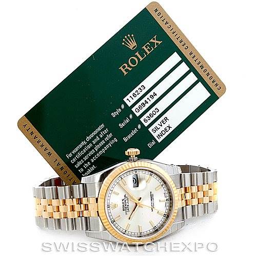 The image shows a Rolex Datejust 116233 Men's Stainless Steel Silver Dial 116233 Men's Stainless Steel Silver Dial watch placed beneath a warranty card at an angled front view, highlighting its two-tone bracelet and face.