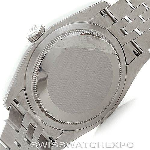 The image shows the case back and part of the bracelet of a Rolex Datejust 116200 Men
s Stainless Steel Black Dial 116200 Men
s Stainless Steel Black Dial watch from a rear angle.