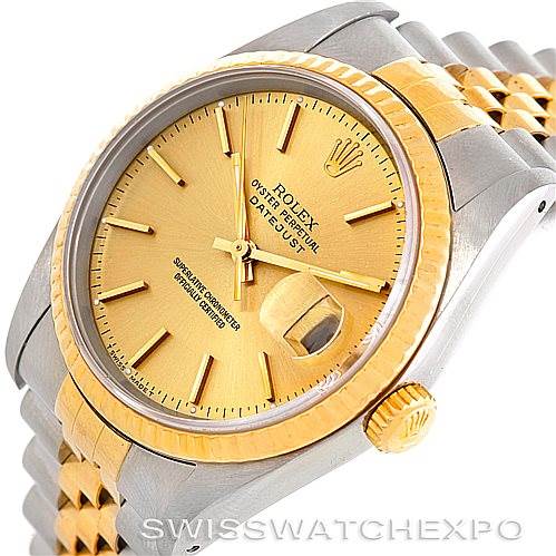 This image shows a partial side-angle view of the Rolex Datejust 16233 Men's Steel and Gold (two tone) Champagne Dial 16233 Men's Steel and Gold (two tone) Champagne Dial watch, highlighting the gold bezel, dial, crown, and two-tone bracelet.