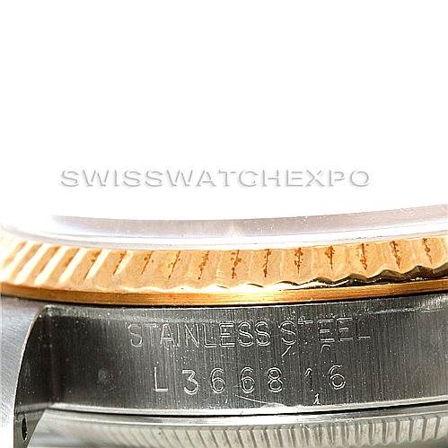 The image shows a close-up angle of the Rolex Datejust 16233 Men's Steel and Gold (two tone) Champagne Dial 16233 Men's Steel and Gold (two tone) Champagne Dial watch, focusing on the bezel and case with visible engravings.