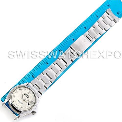 The image shows a top-down view of a Rolex Datejust 16220 Men's Stainless Steel Beige Dial 16220 Men's Stainless Steel Beige Dial watch, including the watch face, bracelet, and a measuring ruler.