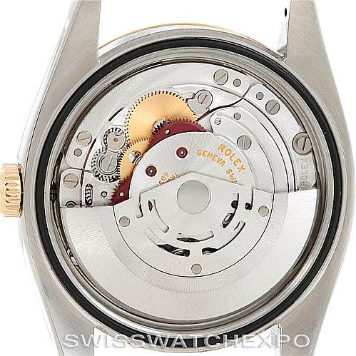 The image shows the Rolex Datejust 116233 Men's Stainless Steel White Dial 116233 Men's Stainless Steel White Dial model's open case back, revealing its intricate movement and internal components.