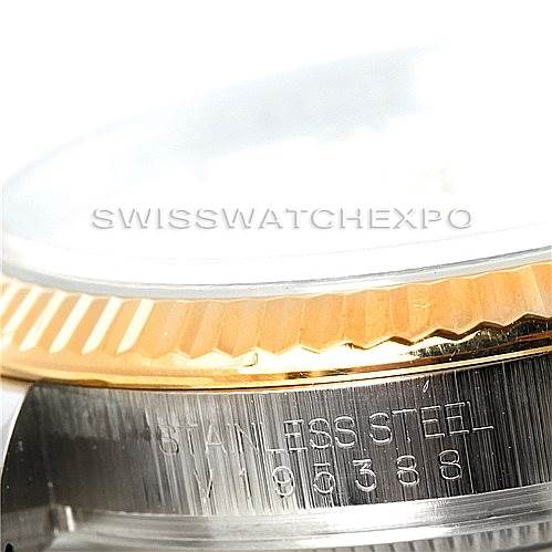 The image shows a close-up of the side of a Rolex Datejust 116233 Men's Stainless Steel White Dial 116233 Men's Stainless Steel White Dial, highlighting its fluted bezel and stainless steel case.